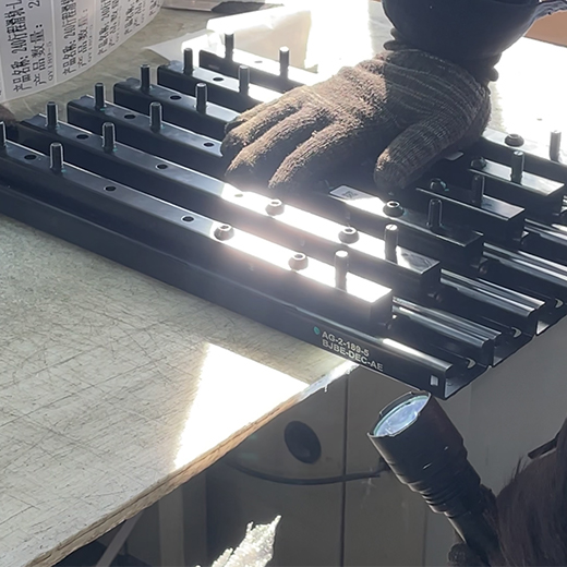 The sliding rails are undergoing final testing before packaging.